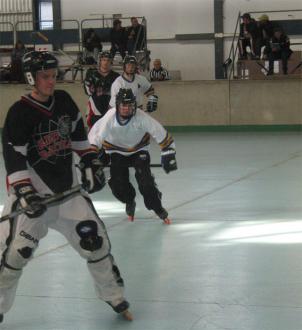 Ryan Hellyer (me) with the orange wheels swooping in on a Redback player